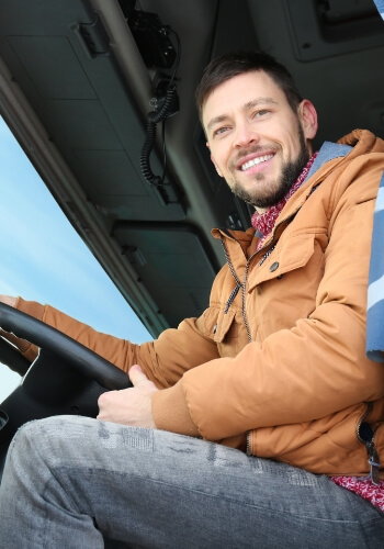 Man in an eighteen wheeler truck, Spurlock Transport, Lafayette, IN
